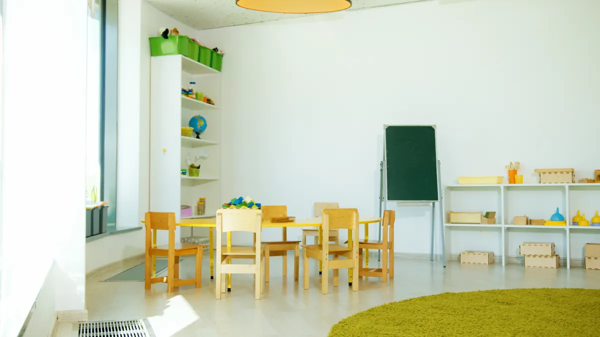 Safe toddler play — The Complete Guide Neat toddler classroom with small tables and shelves